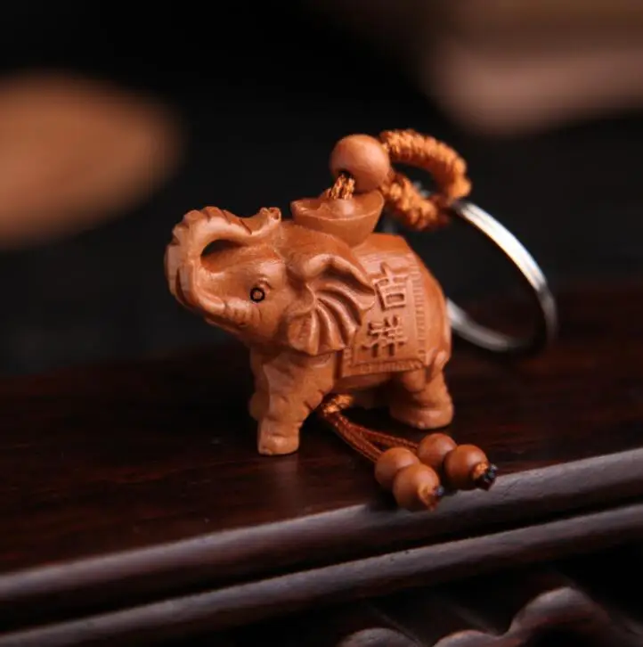 

Chinese Peach Wood Carved Safe And Good Luck Word Animal Elephant Exquisite Car Key Chain Pendant