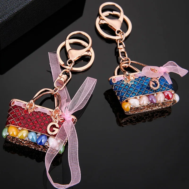

Missxiang New Enamel Crystal Bowknot HandBag Keychains Stylish Purse Bag Buckle Pendant for Car Keyrings Key Chains Holder Women