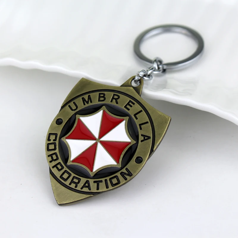 

Horror Resident Evil Keychain Red Umbrella Shield Pendant Keychain Keyring Game Jewelry For Men Women Car Handbag Chaveiro