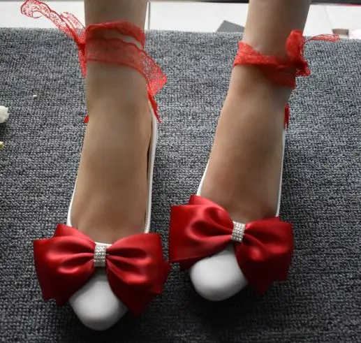 red flat shoes with bow