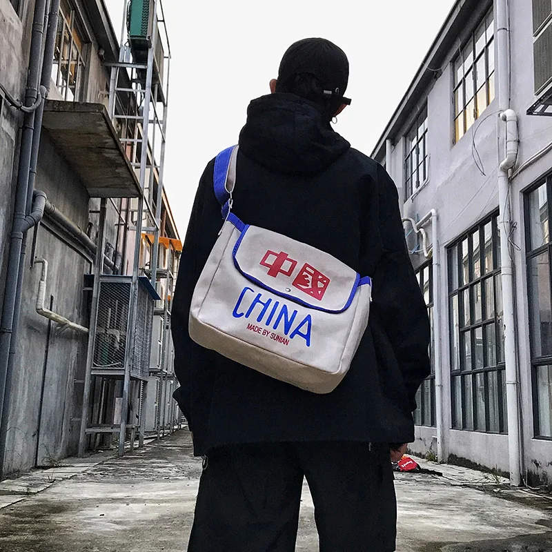 

Fashion male shoulder bag Chinese character style couple Wear resistant Super fire portable Messenger bag female canvas big bag