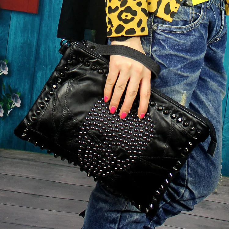 

Free shipping Pure sheepskin hand bag shoulder bag skull head rivet hand bag personality one shoulder aslant leather handbag