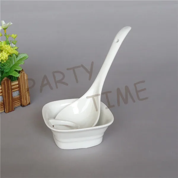 Ceramic spoon and a rest, kitchen ladle and a ceramic standin Spoon