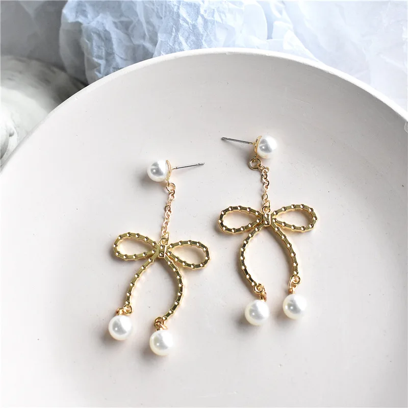 

Statement Bow Earrings for Women Girls Simple Cute Ear Imitation Pearl Personality Sweet Ribbon Earrings Pendant Jewelry Female