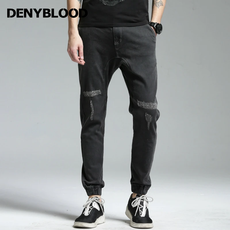 black jeans ripped at bottom