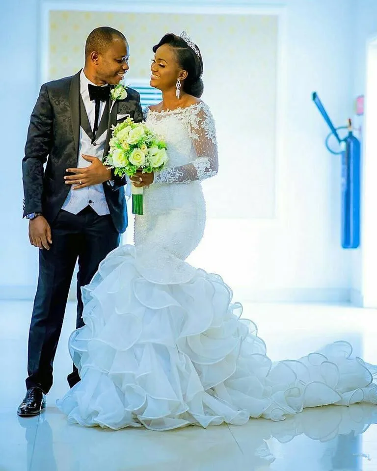 

Modern African Mermaid Wedding Dresses Illusion Long Sleeves Lace Applique Ruffles Train Beaded Arabic Garden Church Bridal Gown