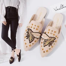 

2018 N spring and autumn new Korean version of the super fire rivet lazy slippers Baotou ladies flat bottom half slippers