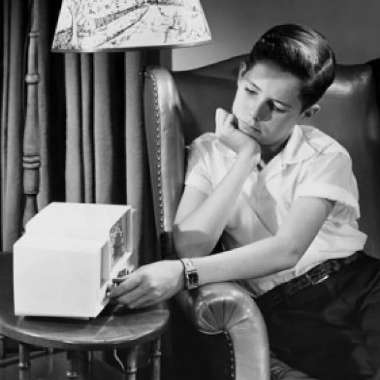 Boy operating radio Poster Print (18 x 24)