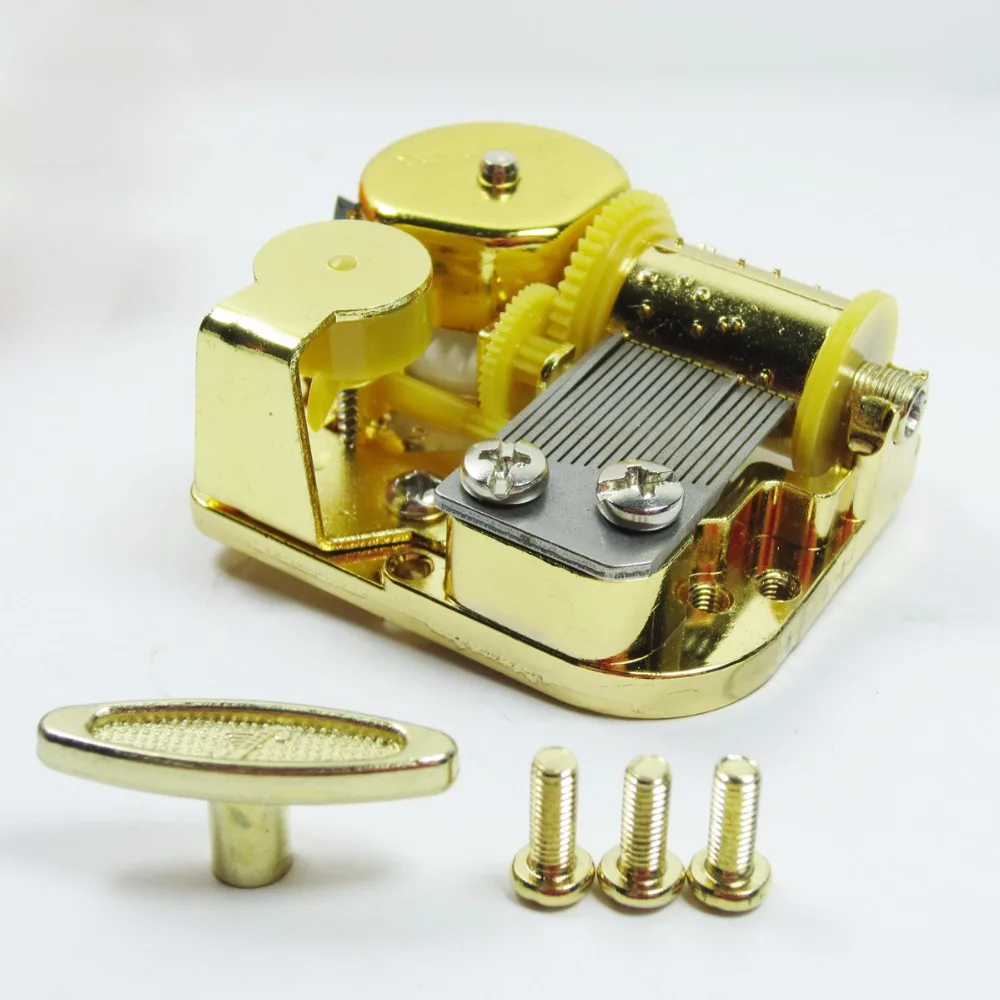 Golden wind up music box mechanism Hedwig's themewind up music box