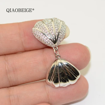 

QIAOBEIGE Inlaid zircon shell 925 silver pearl cage Inside pearl honey wax amber turquoise necklace pendant DIY accessories
