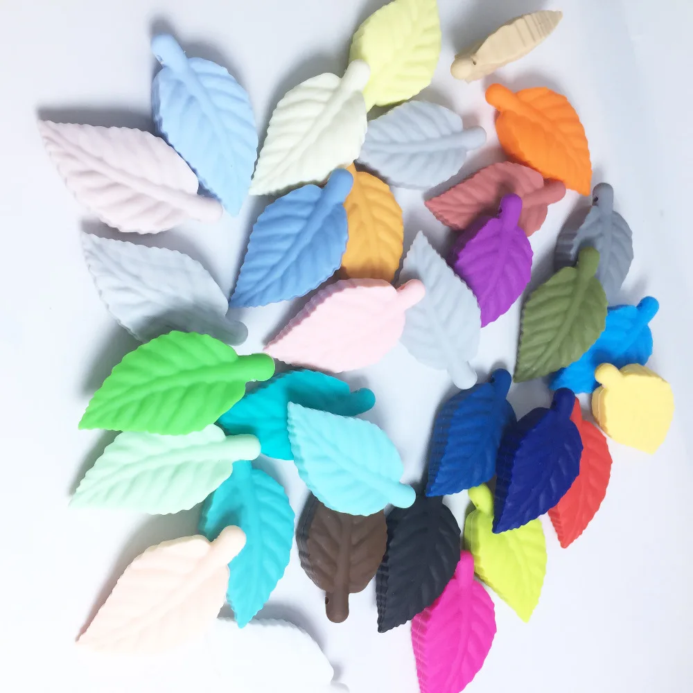 

Baby wrist pendants Maple leaf Beads Silicone Leaf Beads Pendant Suitable for Baby Chew New Design flexible silicone Candy Leaf