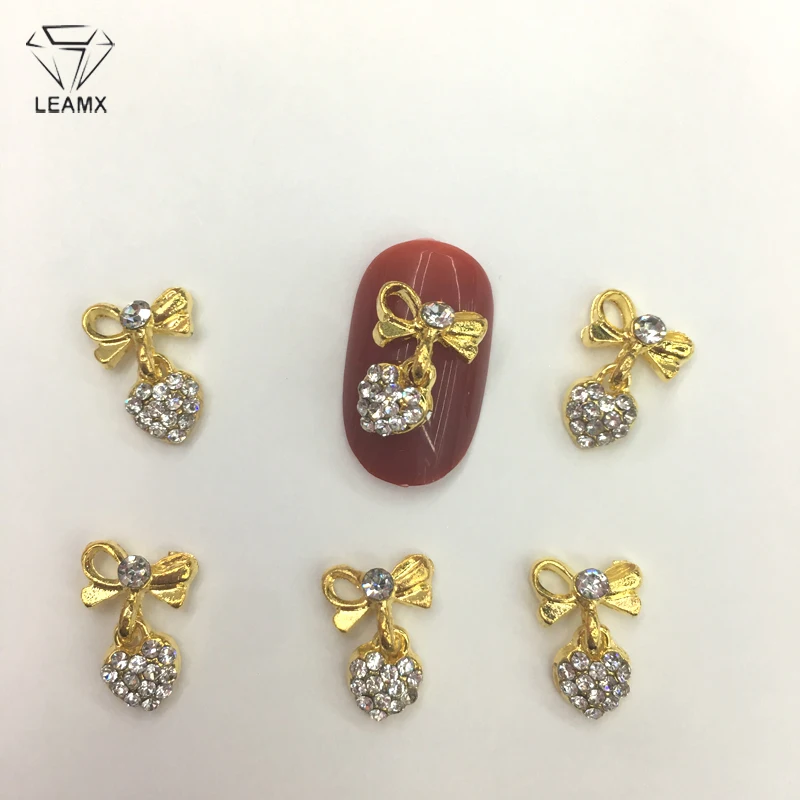 

LEAMX 10 PCS/bag Clear Rhinestones Nails Art Decorations 3D Bow With Heart Nail DIY Accessories Alloy Nail Love Shape Charm L418