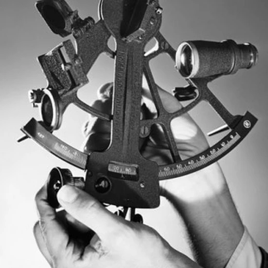 Close-up of a man's hand holding a sextant Poster Print (24 x 36)