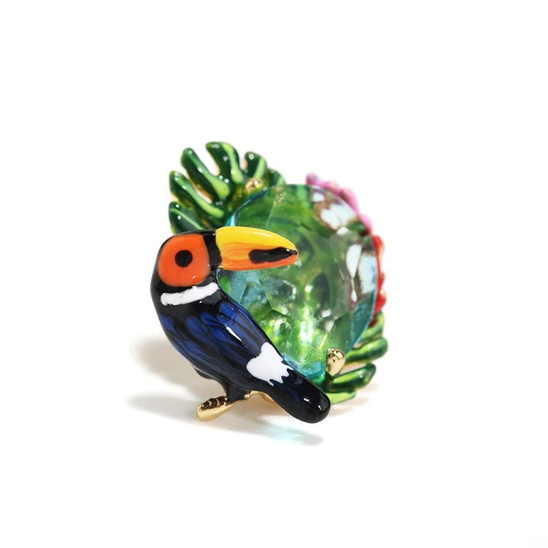 

Contracted corsage, tropical rainforest palm leaves hornbills parrot brooch