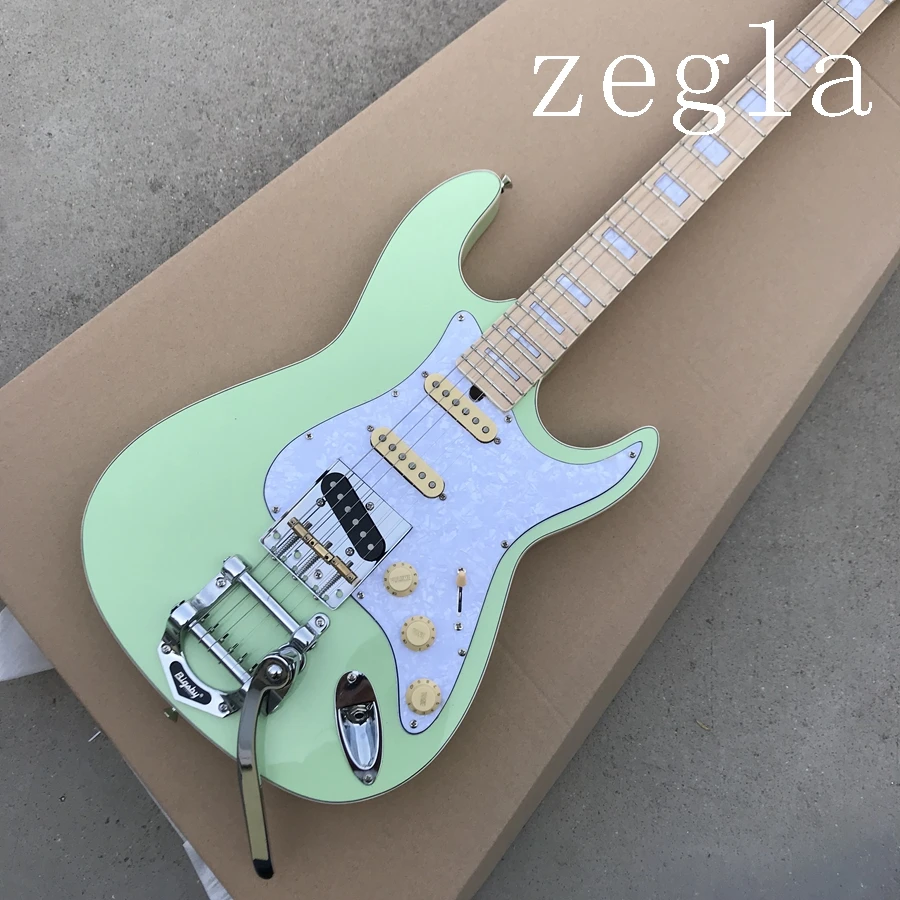 

new arrival electric guitar,solid manogany body ,chore hardware with bigsby,green colour,free shipping