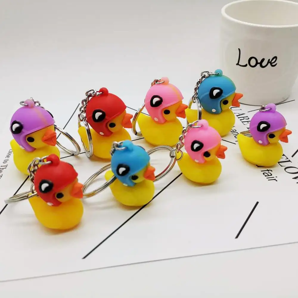 

Wearing a helmet small yellow duck keychain pendant 3D stereo PVC yellow duck Cute Key Chain bag hanging