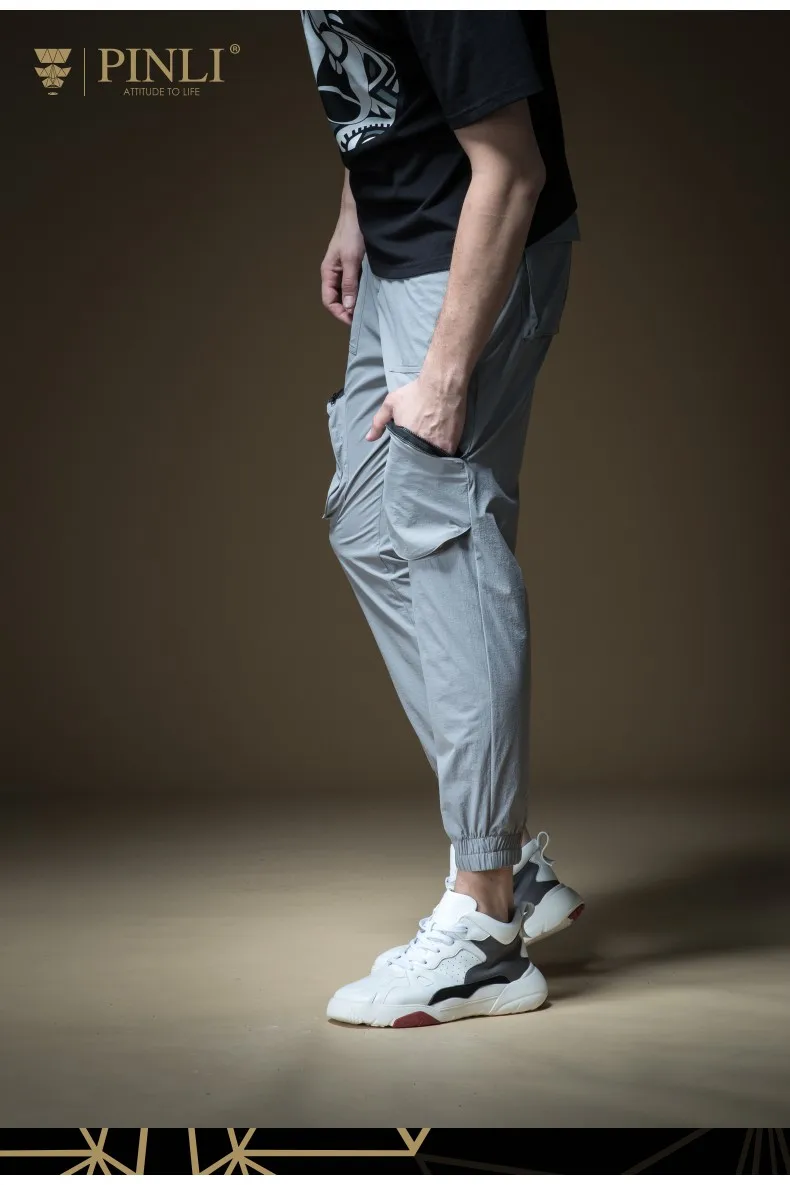 2018 Топ бросился Jogger брюки для мужчин Pinli лето для мужчин Мульти-мешок брюки, ног привязки комбинезоны, маленький footed Досуг B192217181