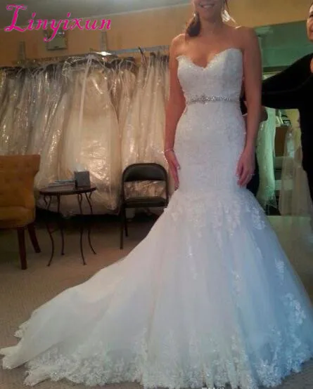 

Luxury Applique Crystal Mermaid Wedding Dresses With White Sweetheart Sleeveless Open Back Sweep Train Bridal Gown