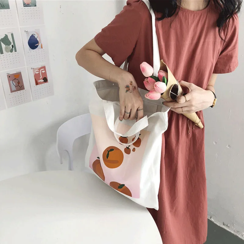 

Harajuku new large size ulzzang orange cartoon print canvas ins Korea shoulder bag fun fashion female Preppy art bags