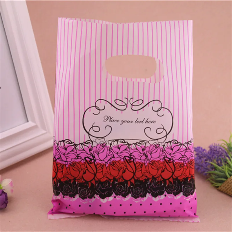 

2016 New Design Wholesale 100pcs/lot 20*25cm Mixed Luxury Flower Plastic Packaging Bags With Handles Favor Wedding Gift Bags