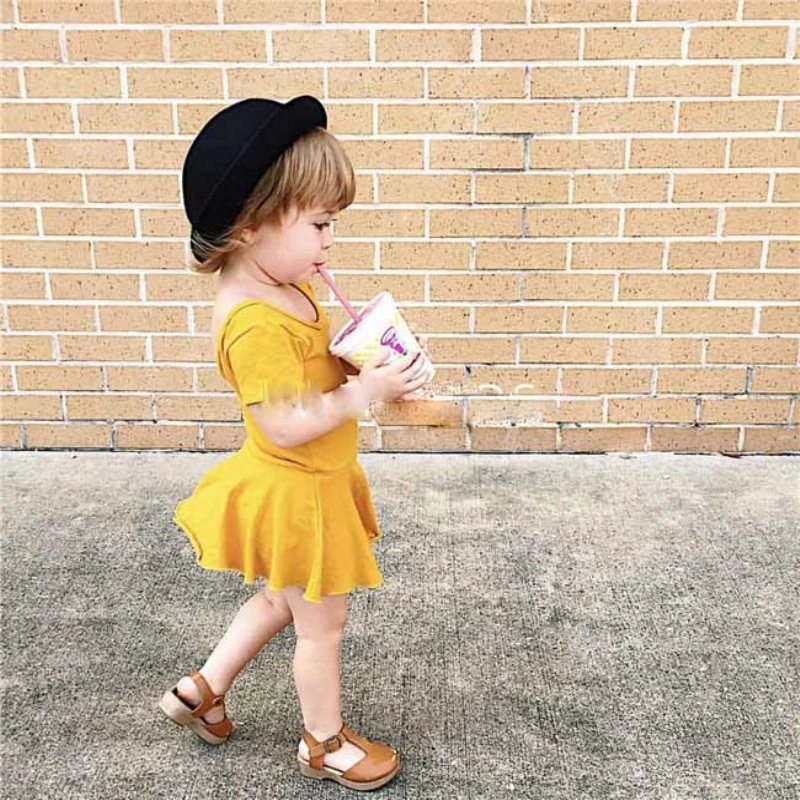 cute baby girl in yellow dress