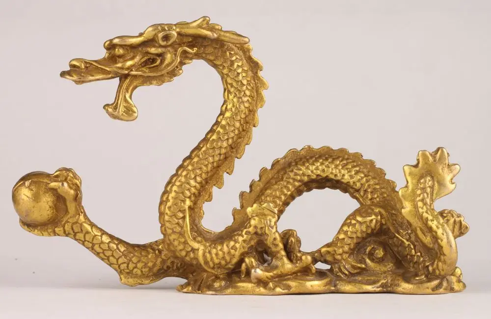 

Elaborate Chinese brass casting Lucky Dragon play bead statue