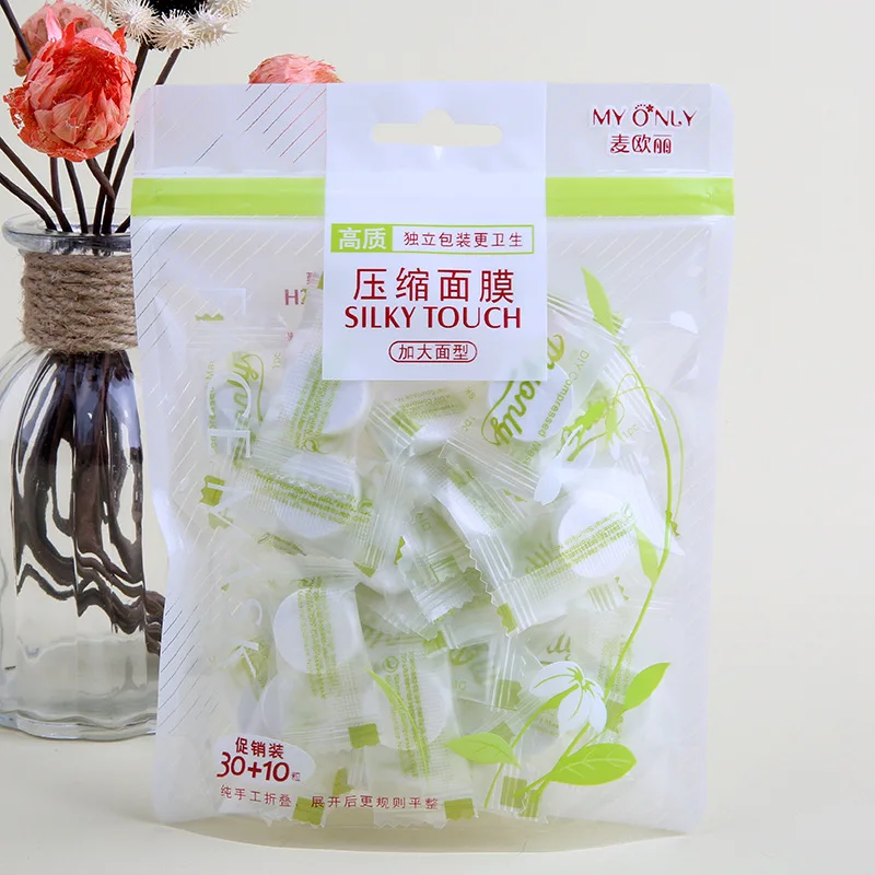 

40 wholesale wholesale non-woven confectionery compression mask pure cotton thin disposable facial mask paper