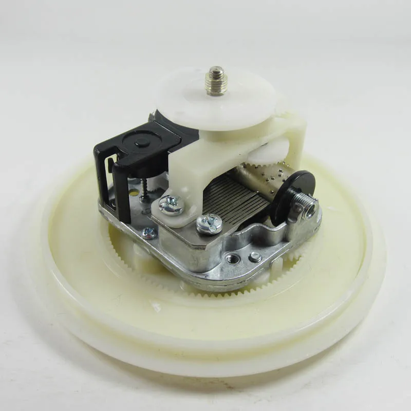 

DIY music box mechanism with rotating plate and base in contrary direction