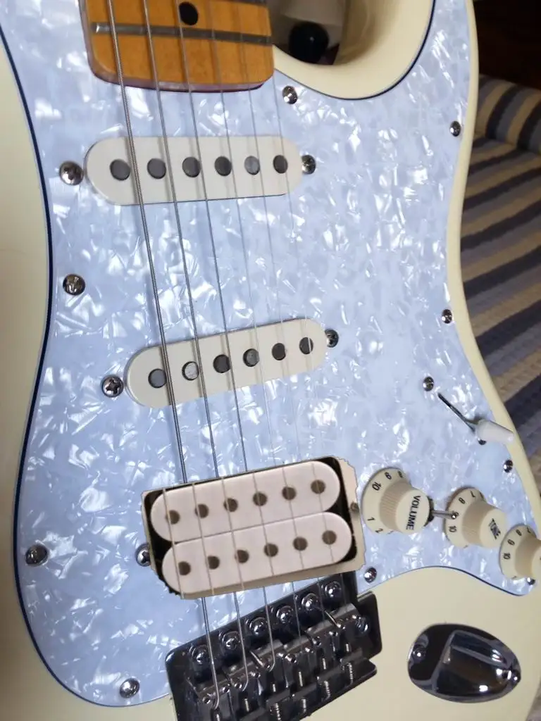 

Pearl pickguard to load pickups and electronics