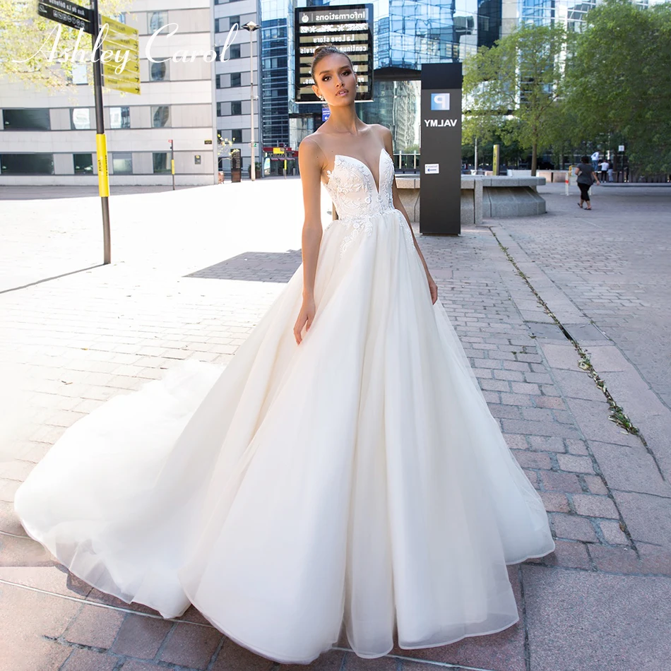 

Ashley Carol Sexy Deep V-neckline Beaded Backless Tulle Wedding Dress 2019 Simple Sleeveless Court Train Princess Wedding Gowns