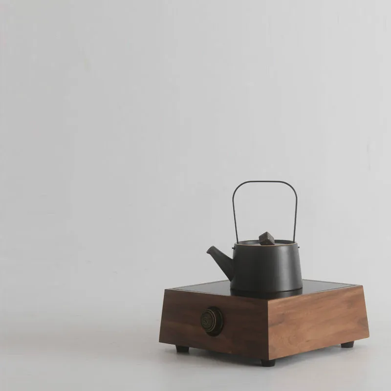 

Hot Plates The small boiled tea stove in walnut doesn't pick the kettle to make tea.NEW