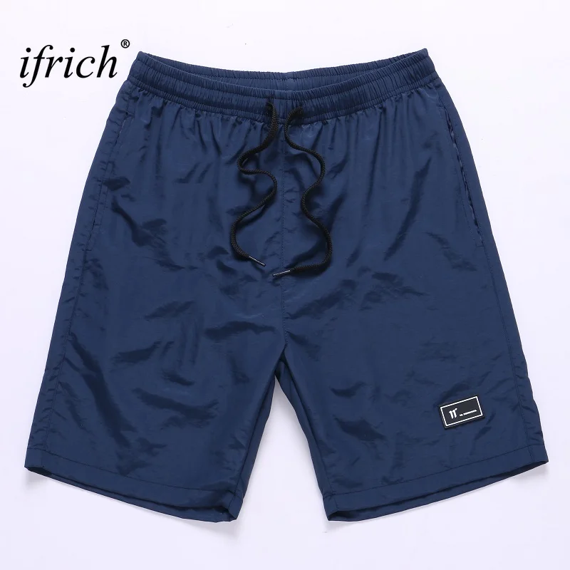 Мужские шорты, летние пляжные новые модные шорты с карманами, мужские однотонные свободные дышащие черные шорты с эластичной резинкой на талии, мужские шорты