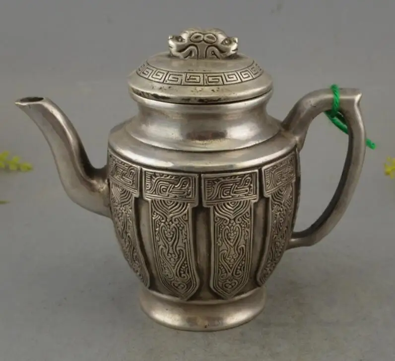 

Chinese Tibetan Silver Handwork Carved Ancient Patterns Teapot