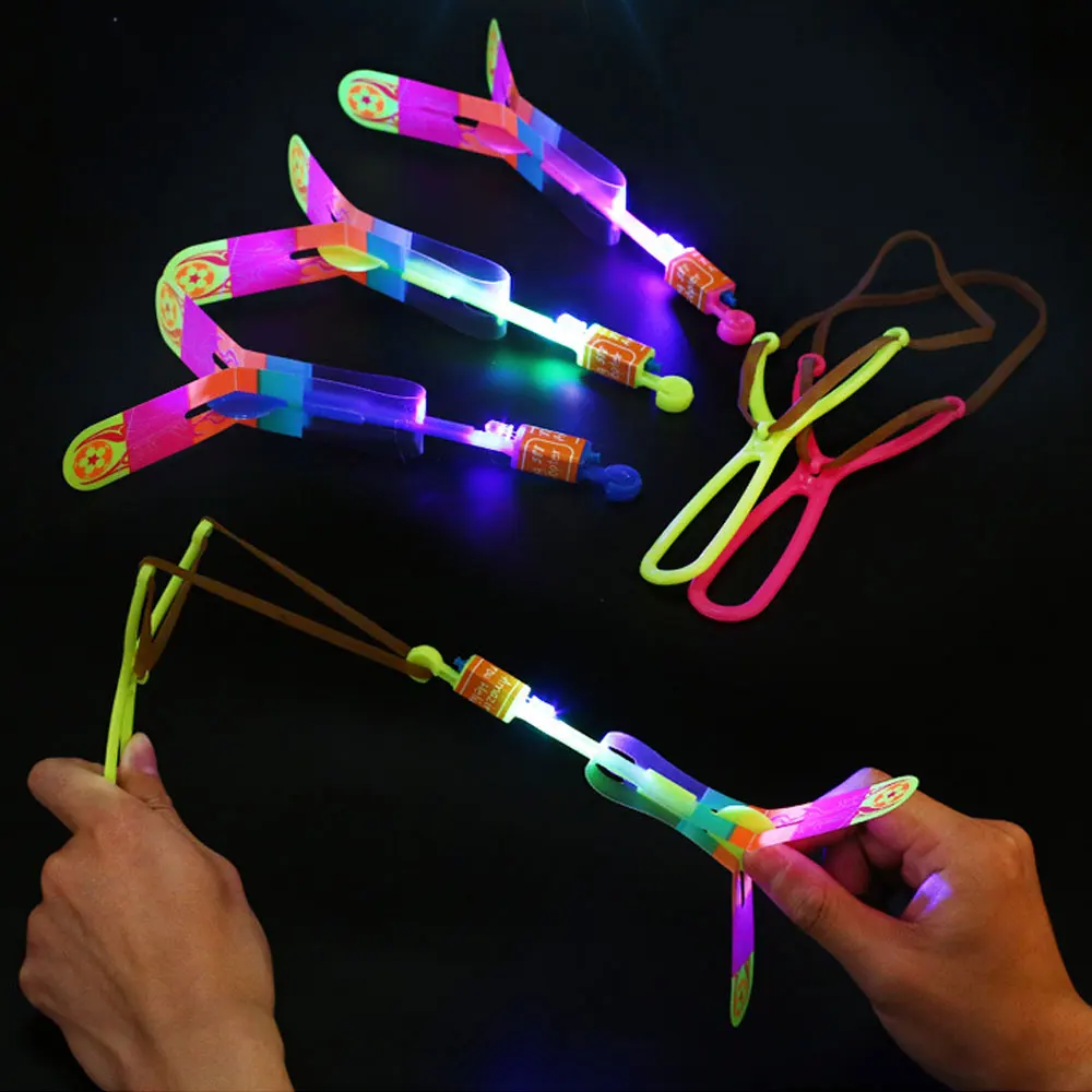 

1PC Amazing LED Light Arrow Rocket Helicopter Rotating Flying Toys Party Fun Kids Outdoor Flashing Toy Fly Arrow