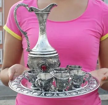 

In ancient China, gold-plated silver opal teapot and cups and tray