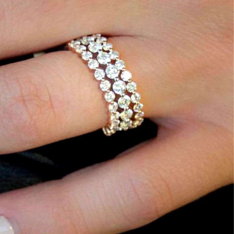 

Two small Full Ring in 2mm Df Moissanite Enternity in 14K Yellow Gold And the big one is 2.5mm Ring in 14K White Gold (3 rings )