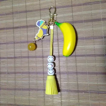 

12pcs/lot PU Banana Series Key Chain Yellow Wooden Afica Map Keyring Wood Smile & Suede Tassel Bag Car Key Ring DIY Craft Gifts