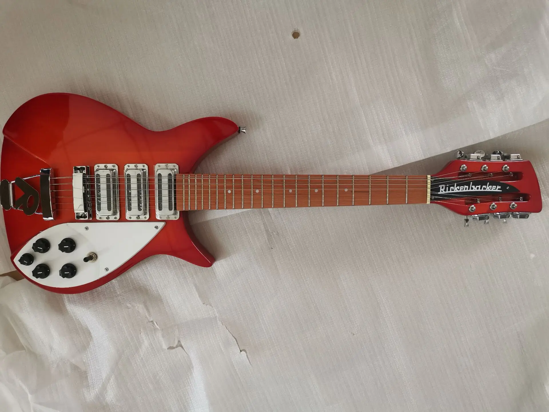 

electric guitar 325 black guitar fingerboard has varnish on it 12 strings 34 inches
