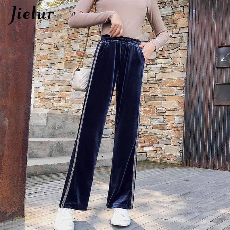 black trousers with gold side stripe