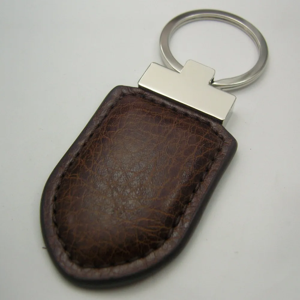 

custmised lapel pin badge,leather key chain,zin alloy,