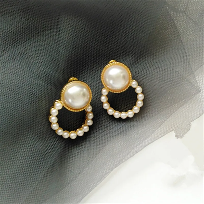 

Round white pearl earrings Simple geometric pearl earrings 2019 trend aesthetic personality pearl stud earrings for women