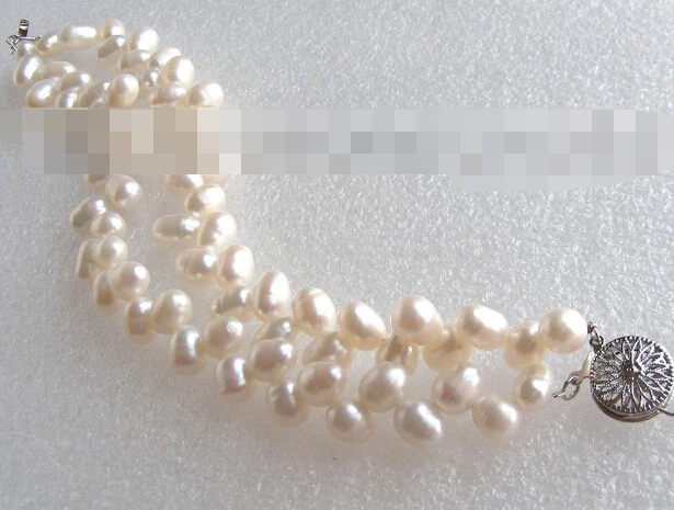 

03768 Butterfly double white nautral pearls bracelet