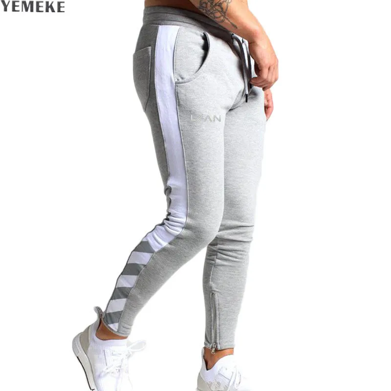 

YEMEKE High Quality Jogger Pants Men Fitness Bodybuilding Gyms Pants Fashion stitching Winter Sweat Trousers Britches