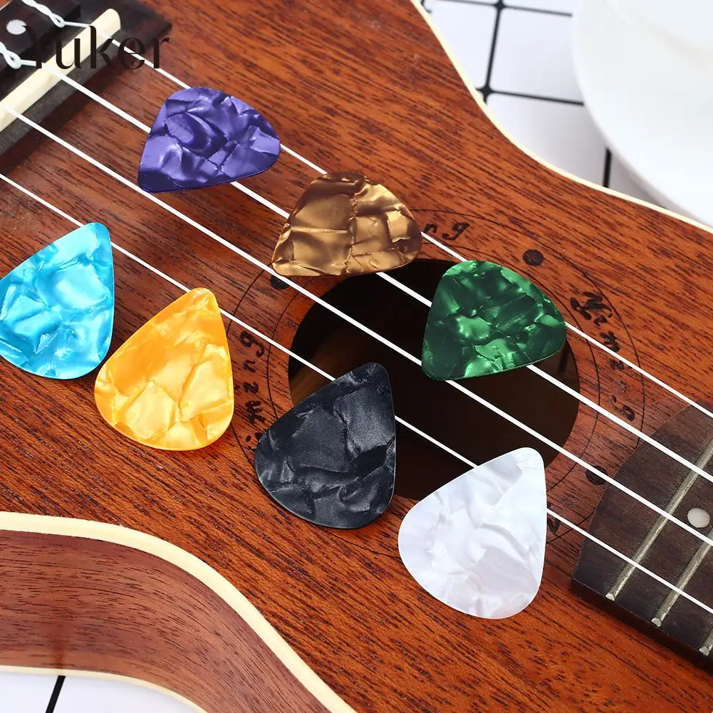 25pcs colorful 0.51/0.71/0.46mm thickness Guitar Picks Plectrums Celluloid Mediators Bass Guitar parts -