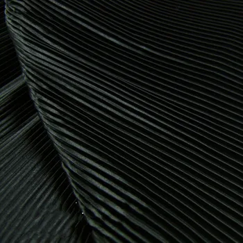 

Garment fabric of pure black pinstripe accordion pleated silk satin crushed through dress fabric