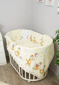 

Bed linen in the crib "giraffe" 7 items with sides-pillows