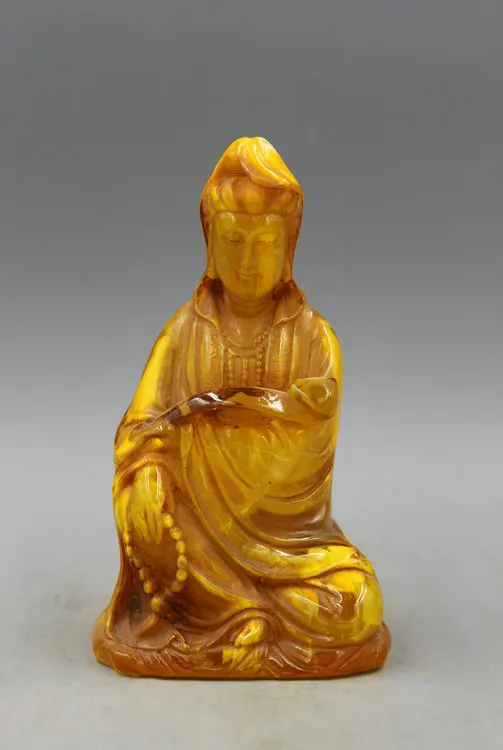 

The Baltic Sea amber crafts antique old wax ornaments sit wishful Guanyin
