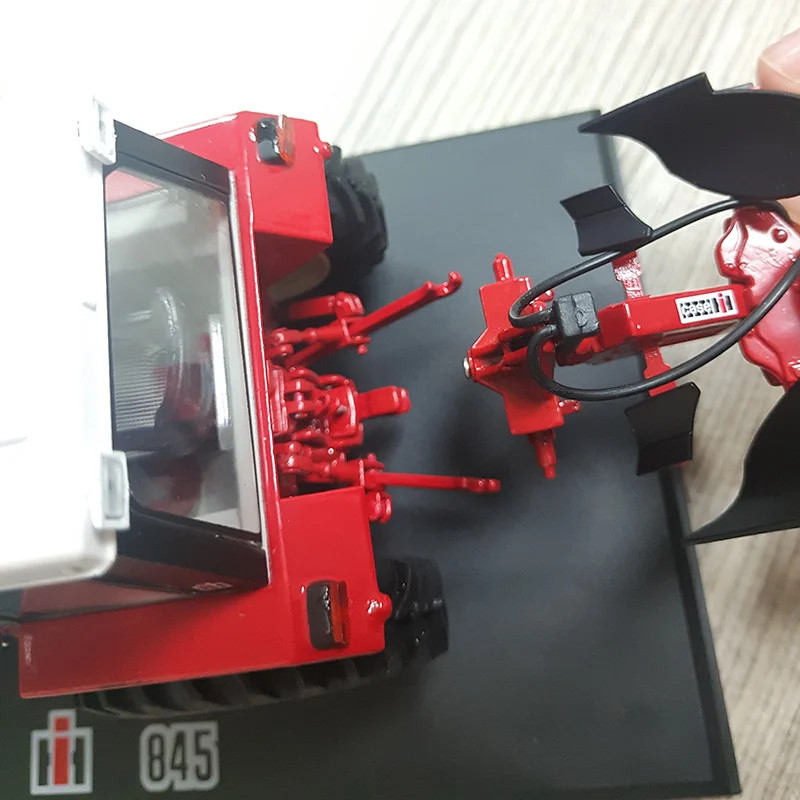 red metal tractor toy