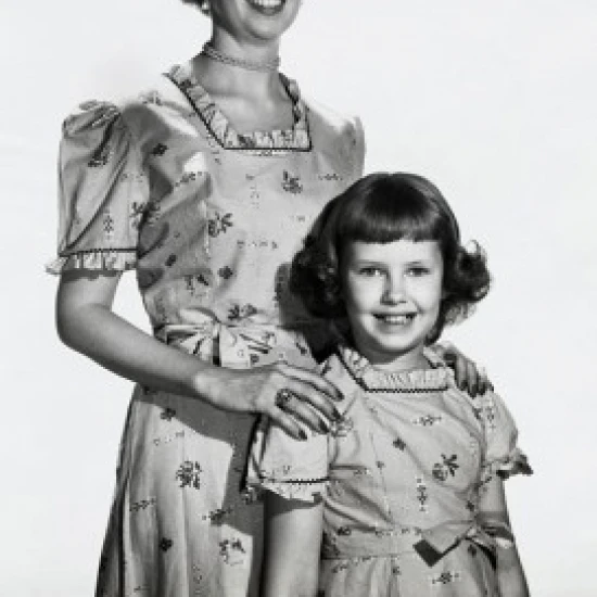 Portrait of a mother smiling with her daughter Poster Print (18 x 24)