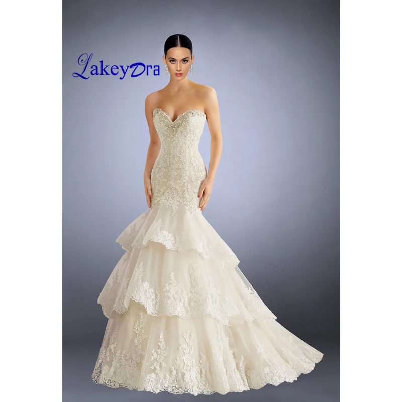 

Lakeydra Mermaid Wedding Dresses White Lace Sweetheart Sleeveless with Appliques Ruffles Beads Plus Size Trumpet Bridal Gowns